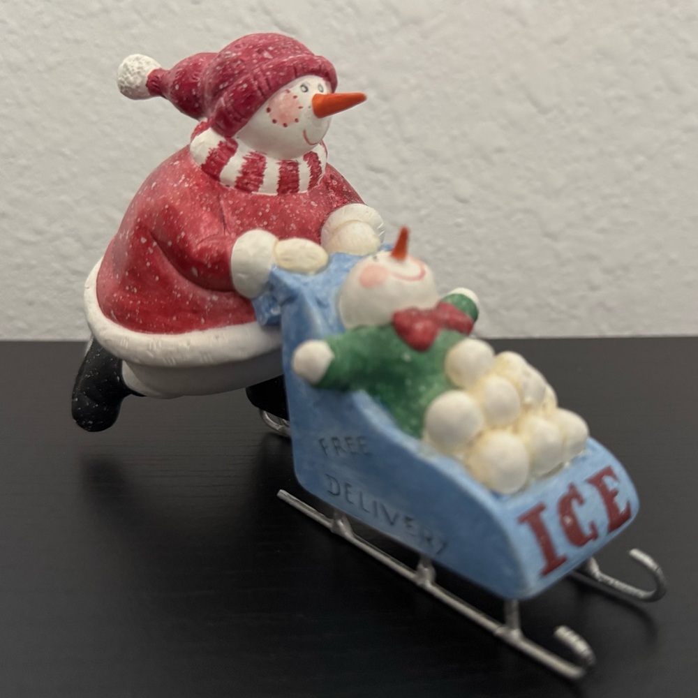 Snowman pulling a sleigh Christmas Decor.